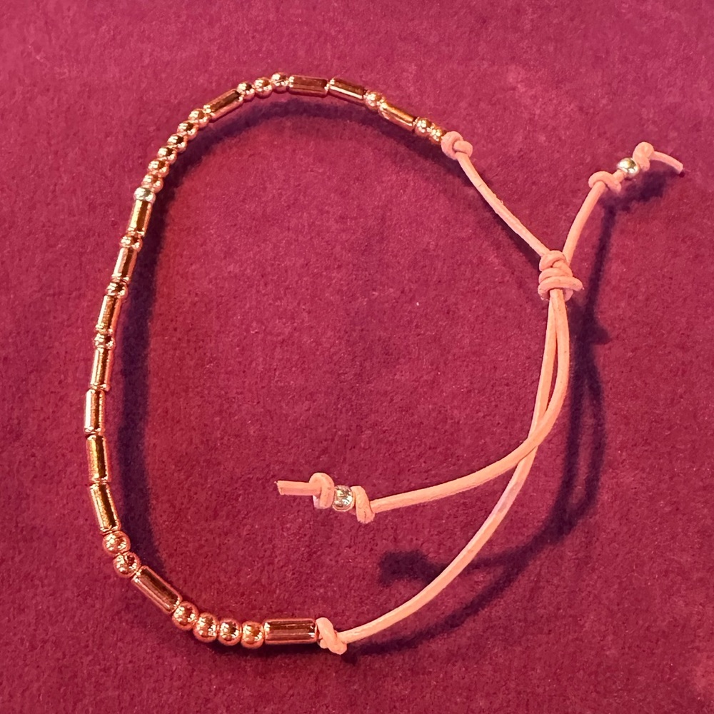Hand crafted Morse code bracelet “Block Island” in rose gold and pink. Unisex